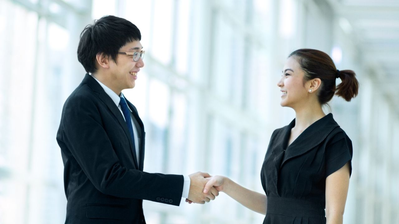 asian people shaking hands